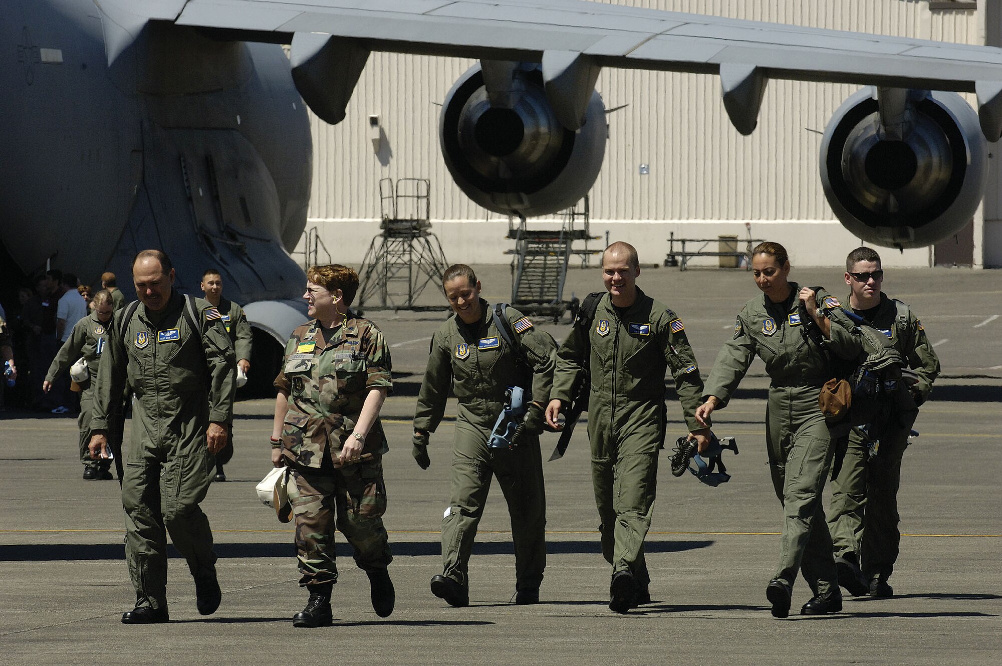 Reserve Airmen from the 446th Aeromedical Evacuation Squadron, McChord Air Force Base, Wash., exit a C-17 at the aeromedical evacuation static configuration event during Air Mobility Rodeo 2007, July 24. The event measured a team's ability to perform aeromedical evacuations in a KC-135 and a C-17. Air Mobility Command's Rodeo 2007 is a readiness competition of U.S. and international mobility air forces. It focuses on improving war fighting capabilities and support of the Global War on Terrorism.   (U. S. Air Force photo/Senior Airman Clay Lancaster)
