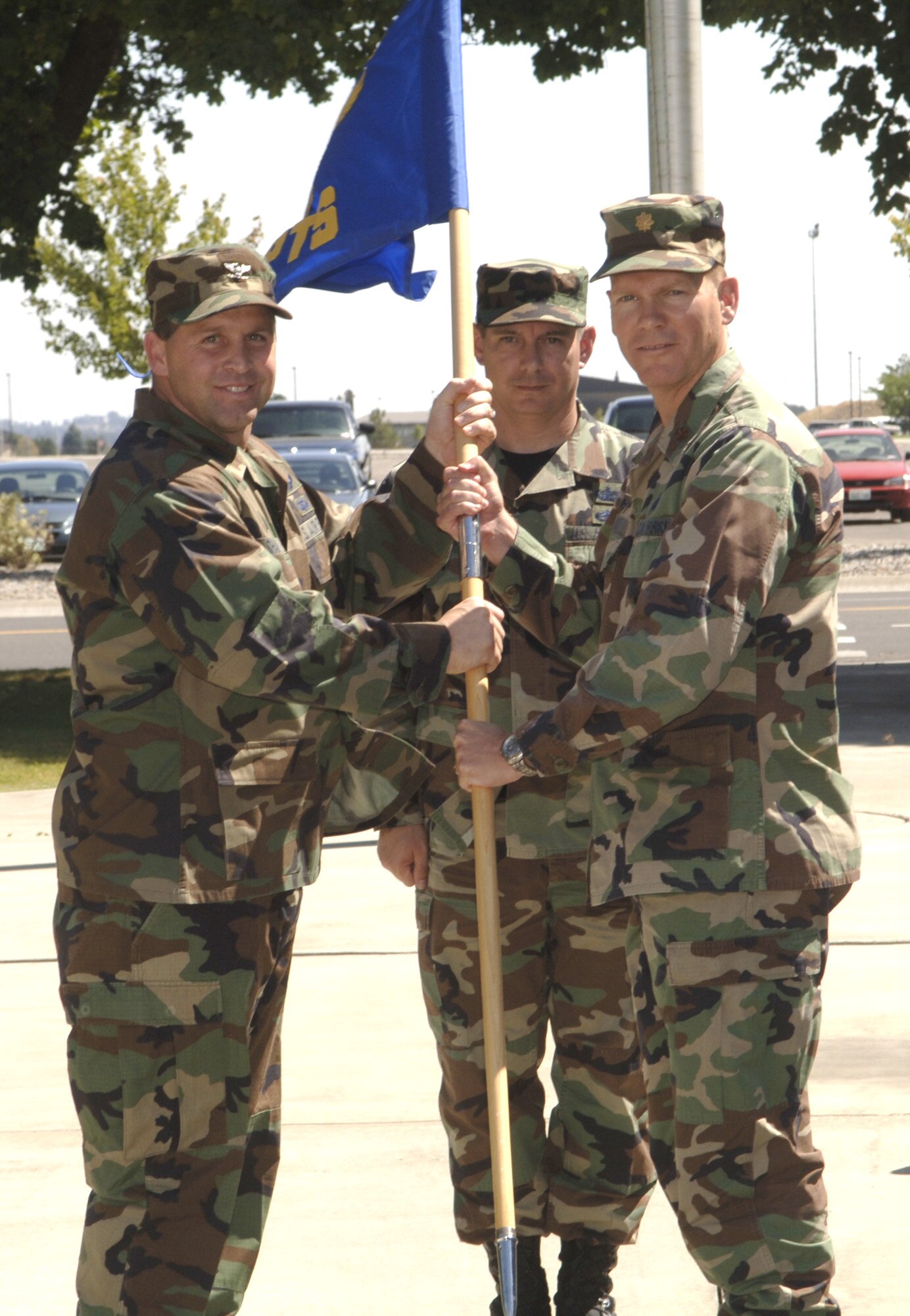 FAIRCHILD AIR FORCE BASE, Wash. – Maj. Michael Gallant, 92nd Comptroller Squadron commander, accepts his new command status Aug. 14 from Col. Thomas Sharpy, 92nd Air Refueling Wing commander. Major Gallant comes to Fairchild from Lajes Field, Portugal. He assumed command from outgoing commander Lt. Col. Timothy Dunster. (U.S. Air Force photo / Senior Airman Chad Watkins)