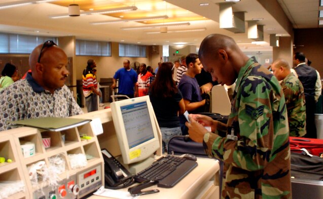 Passenger Counter: Senior Airman McCarty, 45th APS, checks in a passenger traveling downrange.  The team processed over 3100 passenger during the two-week exercise. (U.S. Air Force photo by Capt. Kelly Gabel)