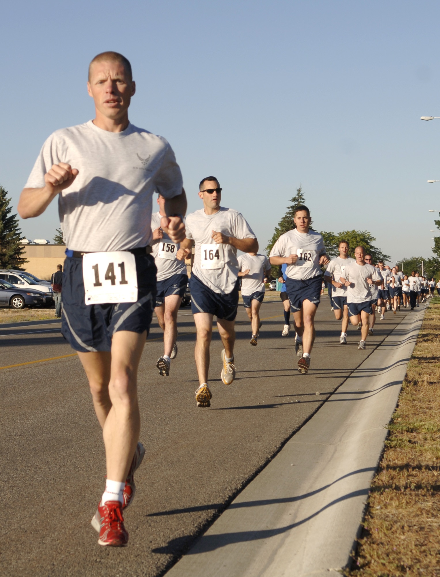 FAIRCHILD AIR FORCE BASE, Wash. -- Tech. Sgt. Michael Bergquist, Washington Air National Guardsman activated to the 92nd Security Forces Squadron at here, leads the pack during a base-wide 5k run Aug. 10. Sergeant Bergquist trains daily for such competitions, and recently finished sixth in the Armed Forces Triathlon Championship, earning himself a spot on the all Military Team USA, which heads to India for the Military World Games in October. (U.S. Air Force Photo / Senior Airman Chad Watkins)