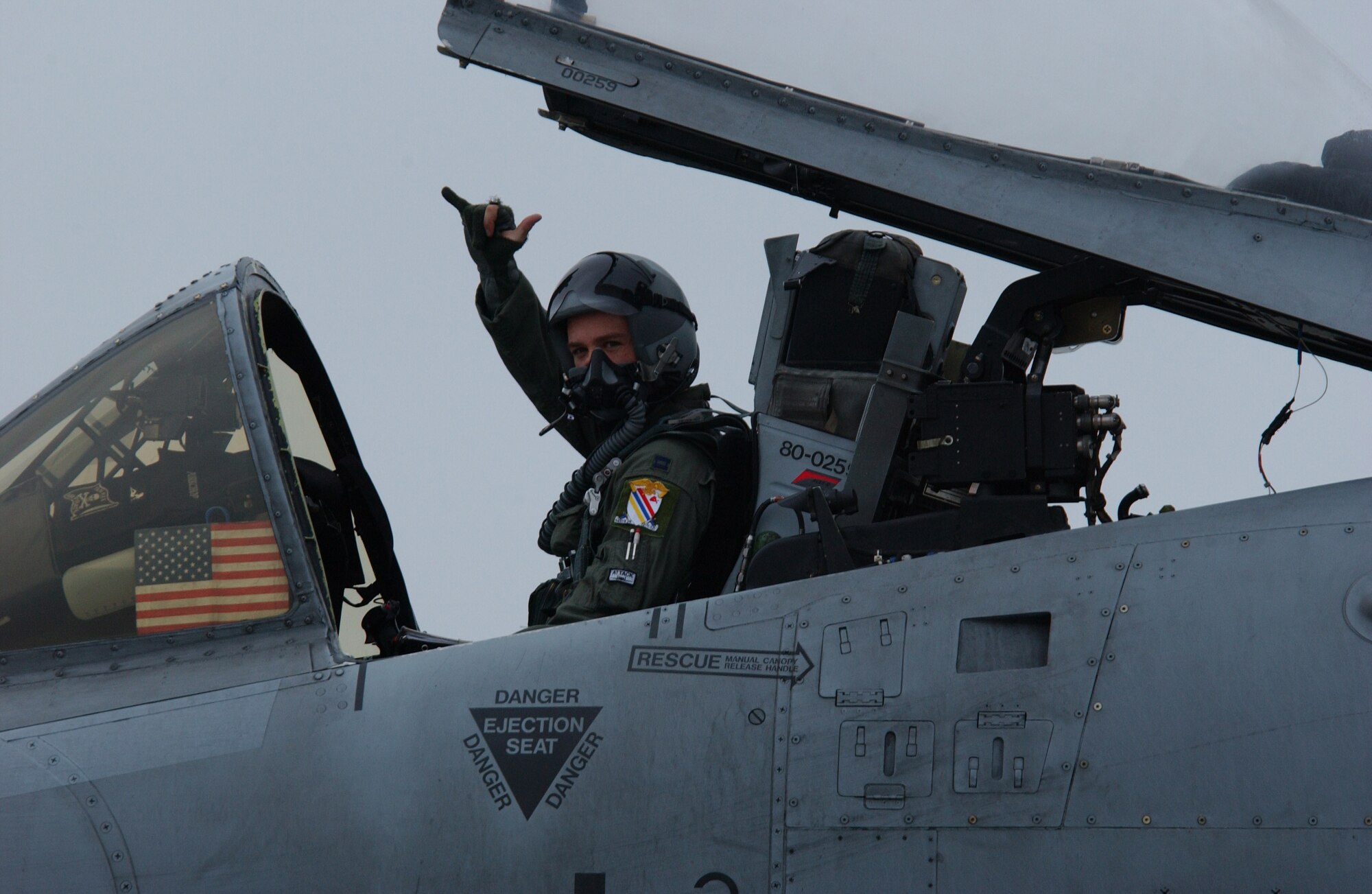 EIELSON AIR FORCE BASE, Alaska -- Capt. Dale Stark, 355th Fighter Squadron, signals from his aircraft prior to their final departure of the A-10 Thunderbolt II Aug. 15. The first two A-10s arrived at Eielson Dec. 18, 1981; the last two A-10s left today for Moody AFB, Ga., and Gowen Field, Idaho. (U.S. Air Force Photo by Airman 1st Class Jonathan Snyder)(Released)