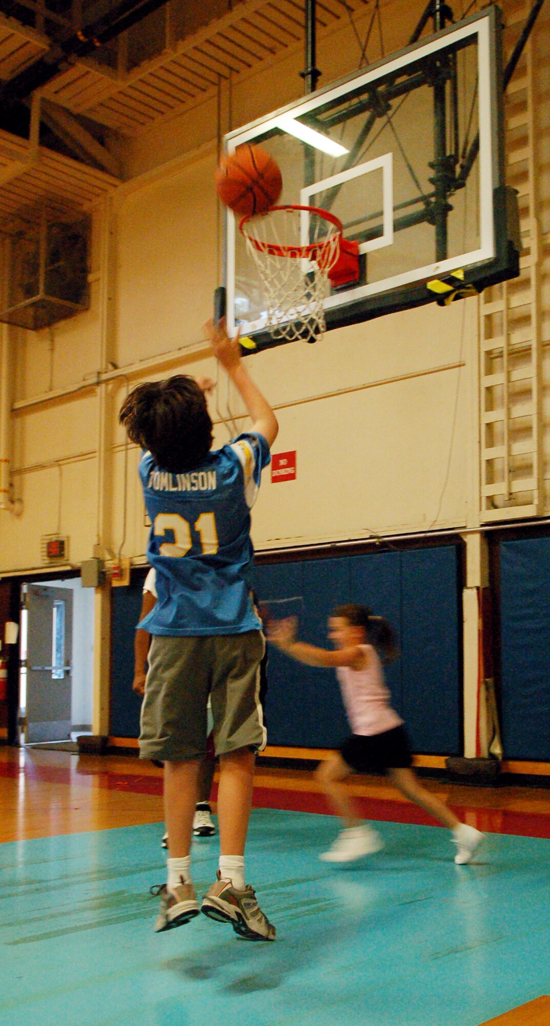 LAUGHLIN AIR FORCE BASE, Texas – Alex Brust, son of Maj. Robert Brust, 87th Flying Training Squadron, and Colleen Brust, takes a jump shot at a basketball camp put on by the Laughlin Youth Center.  (U.S. Air Force photo by Staff Sgt. Austin M. May)