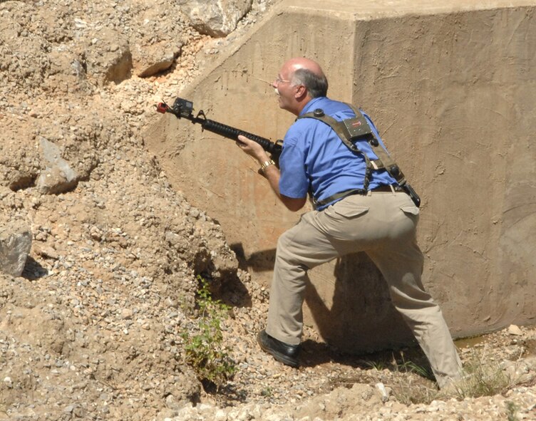 Vance honorary commander Jay Jacobs defends his position during a force-on-force firefight during his deployment to the fictional country of Tarzanistan.  Eight Vance honorary commanders visited the base Tuesday for an insider’s look at the 71st Mission Support Group’s operations. The group was exposed to the deployment mission because Vance has many Airmen deployed or about to deploy. (Air Force photo by Terry Wasson)