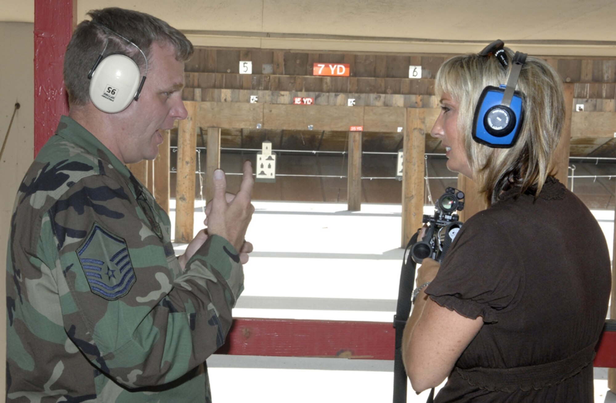 Vance honorary commander Sandra Robinett receives weapons training to prepare to deploy to the fictional country of Tarzanistan.  Eight Vance honorary commanders visited the base Tuesday for an insider’s look at the 71st Mission Support Group’s operations. The group was exposed to the deployment mission because Vance has many Airmen deployed or about to deploy. (Air Force photo by Terry Wasson)