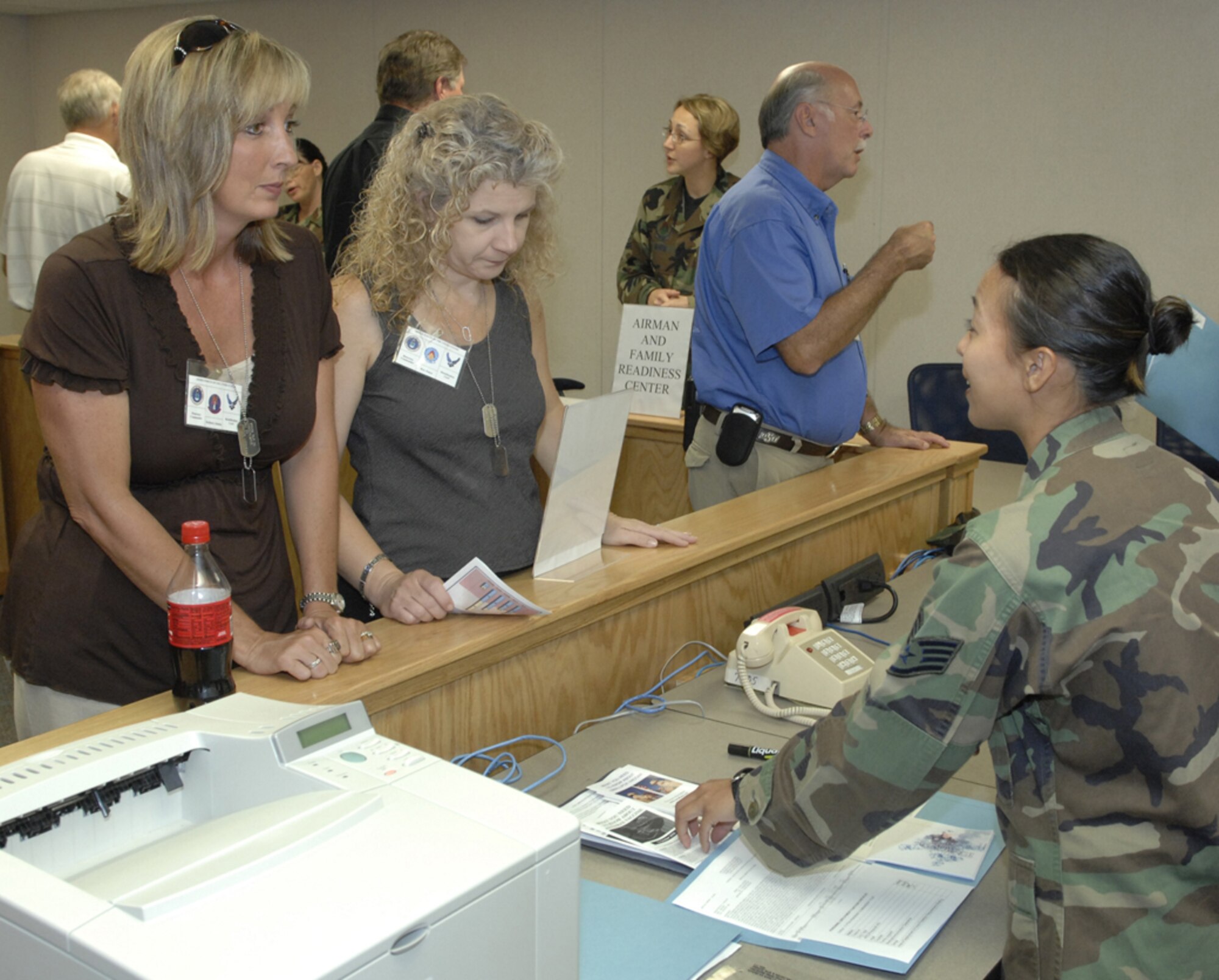 Honorary commanders Sandra Robinett, Sonya Key and Jay Jacobs go through a deployment line to prepare to deploy to the fictional country of Tarzanistan.  Eight Vance honorary commanders visited the base Tuesday for an insider’s look at the 71st Mission Support Group’s operations. The group was exposed to the deployment mission because Vance has many Airmen deployed or about to deploy. (Air Force photo by Terry Wasson)