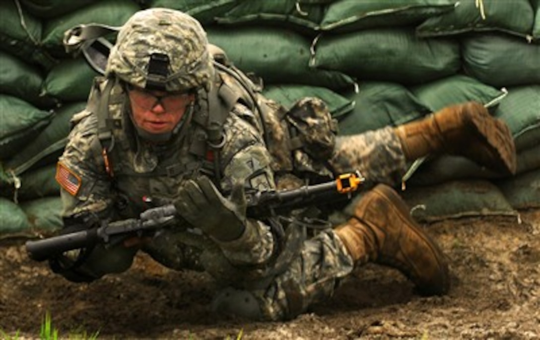 A New Mexico Army National Guardsman maneuvers around an obstacle during individual movement techniques training at Fort Dix, N.J., on Aug. 7, 2007.  Guardsmen of Charlie Company, 2nd Battalion, 200th Infantry Battalion, are at Fort Dix as part of mobilization training for an upcoming deployment in support of Operation Iraqi Freedom.  