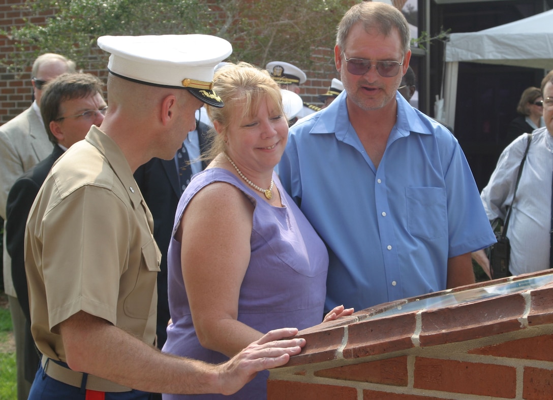 KINGS BAY, Ga. (Aug. 17, 2007)- Lt. Col. Andrew J. Murray (left), commanding officer of Marine Corps Security Force Company, Kings Bay, Ga., speaks to Deb and Dan Dunham, the parents of Cpl. Jason Dunham, a Medal of Honor recipient for Operation Iraqi Freedom, after a barracks dedication ceremony for their son here, Aug. 17. Dunham was stationed here from 2001-2003 before joining 3rd Battalion, 7th Marine Regiment, 1st Marine Division in Twentynine Palms, Calif. Dunham received the Medal of Honor for heroic actions in Karabilah, Iraq, on April 14, 2004. (Official U.S. Marine Corps photo by Cpl. Lucian Friel (RELEASED)