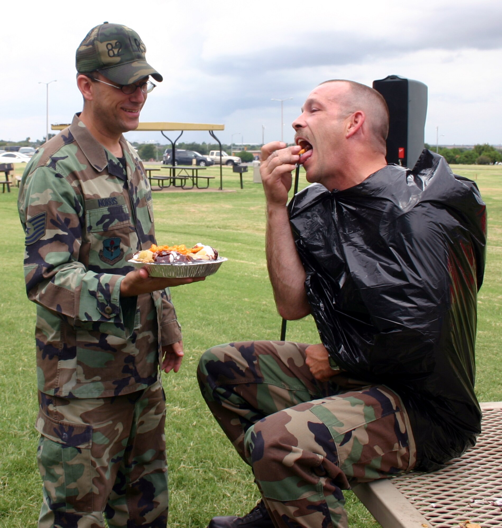 Master Sgt. David Hubbard, 82nd Logistics Readiness Squadron, enjoys a bite of the pumpkin-apple-marshmallow-whipped cream-chocolate sauce-Cheetos pie that Tech. Sgt. Leonard Norris, 82nd LRS, plans to throw in his face at the Enlisted Appreciation Day cookout Aug. 17. (U.S. Air Force photo/Staff Sgt. Tonnette Thompson)