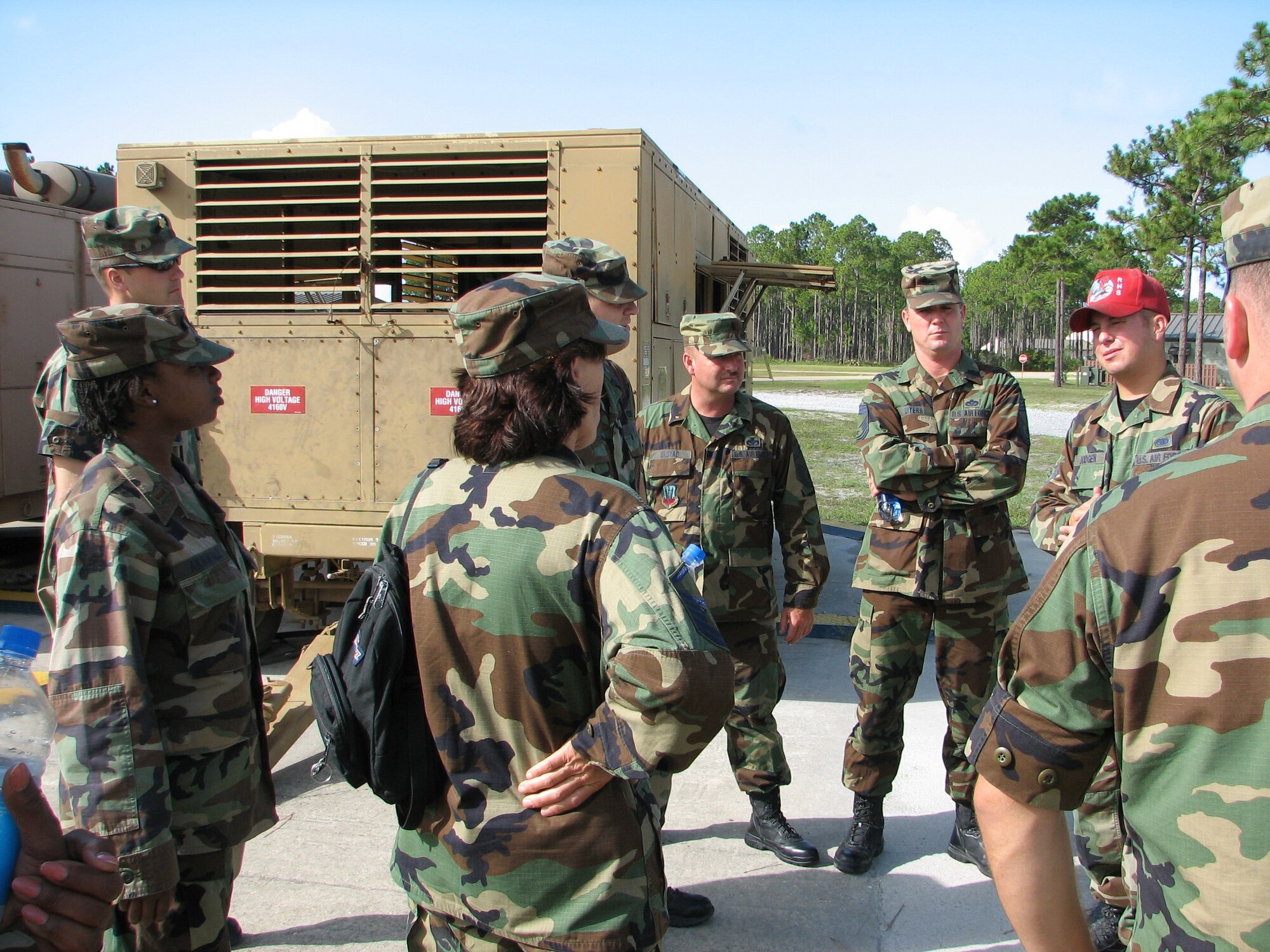 A Red Horse Squadron instructor teaches 163 RW Civil Engineers prior to a scenario start. Facing front, left to right, Chief Master Sgt. Donald Ulstad and Chief Master Sgt. Jeffrey Myers. The team participated in Silver Flag, held at Tyndall Air Force Base, Fla. About 40 members from the Civil Engineering Squadron deployed July 14-20 working alongside Air Force active-duty and Reserve.  (U.S. Air Force photo)