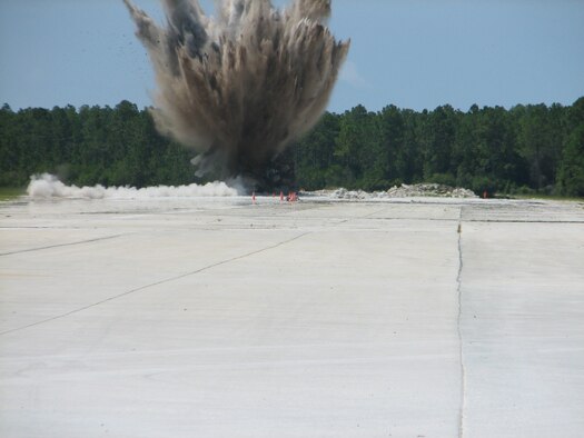 A runway is blown up in preparation for a war-task training exercise, Team members participated in Silver Flag, held at Tyndall Air Force Base, Fla. About 40 members from the 163rd RW Civil Engineering Squadron deployed July 14-20 working alongside Air Force active-duty and Reserve.  (U.S. Air Force photo)