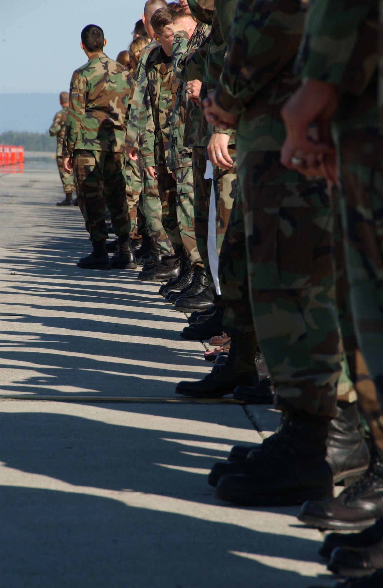 EIELSON AIR FORCE BASE, Alaska --  Airmen anxiously await the arrival of Brig. Gen. Dave Scott, 354th Fighter Wing commander, from his finni flight to greet him with over a hundred person salute Aug. 17, 2007. During the Fighter Wing cookout Gen. Scott taxied by after landing from his final flight at Eielson AFB, to be greeted with over a hundred salutes.  (U.S. Air Force photo by Airman 1st Class Christopher Griffin)