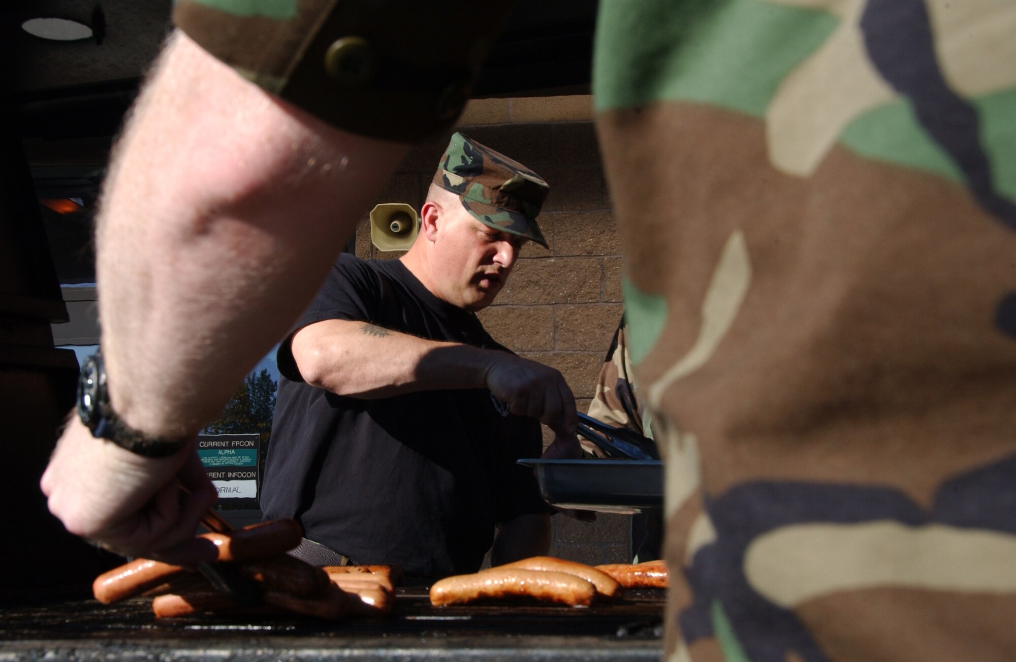EIELSON AIR FORCE BASE, Alaska --  Master Sgt. Fred Sandgren, 354th Force Support Squadron, places the barbequed hotdogs into a platter for the Fighter Wing cook out Aug. 17, 2007. The cookout was held to show appreciation for all the hard work the Iceman team does year round and also for Brig. Gen. Dave Scott, 354th Fighter Wing commander, to show his thanks to all of the airmen of the 354th Fighter Wing. (U.S. Air Force photo by Airman 1st Class Christopher Griffin)
