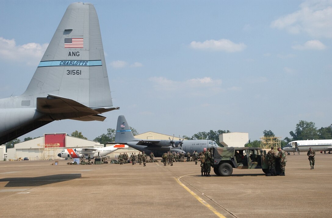 Soldiers with Quick Response Force (QRF) and equipment are offloaded from N.C. Air National Guard C-130s at George Air Field in Alexandria, La., in support of Hurricane Katrina relief effort on Sept. 3, 2005. Members of the QRF will provide security, medical, and humanitarian support. AFNSEP coordinates assets such as these when federal assistance is requested. (U.S. Air Force photo/Tech. Sgt. Brian E. Christiansen) 