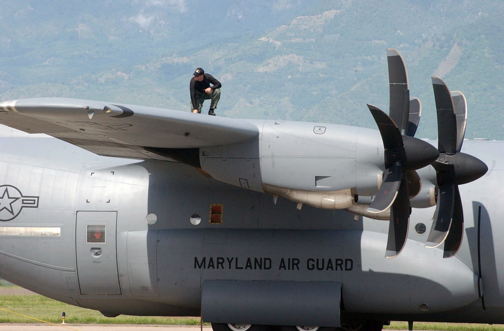 Tech. Sgt. Edward Slavin inspects the exterior of his C-130 Hercules Aug. 17 at Soto Cano Air Base, Honduras, before taking off on a relief mission to Peru. The aircrew is taking approximately 30 Soldiers and Airmen who are responding to the Aug. 15 earthquake in Peru and are taking 4,470 pounds of medical supplies for relief efforts. Sergeant Slavin is a crew chief with the Maryland Air National Guard's 135th Airlift Squadron. (U.S. Air Force photo/Tech. Sgt. Sonny Cohrs) 