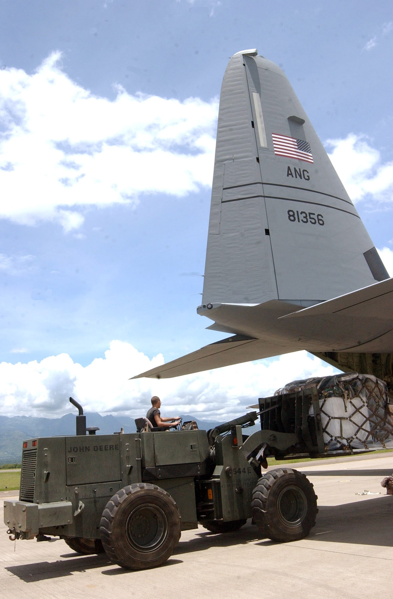 Senior Airman Kenneth Cumbie loads medical supplies onto a C-130 Hercules Aug. 17 at Soto Cano Air Base, Honduras.  Approximately 30 Soldiers and Airmen at are responding to the Aug. 15 earthquake in Peru and are taking 4,470 pounds of medical supplies for relief efforts. Airman Cumbie is assigned to the 612th Air Base Squadron at Soto Cano AB. (U.S. Air Force photo/Tech. Sgt. Sonny Cohrs) 