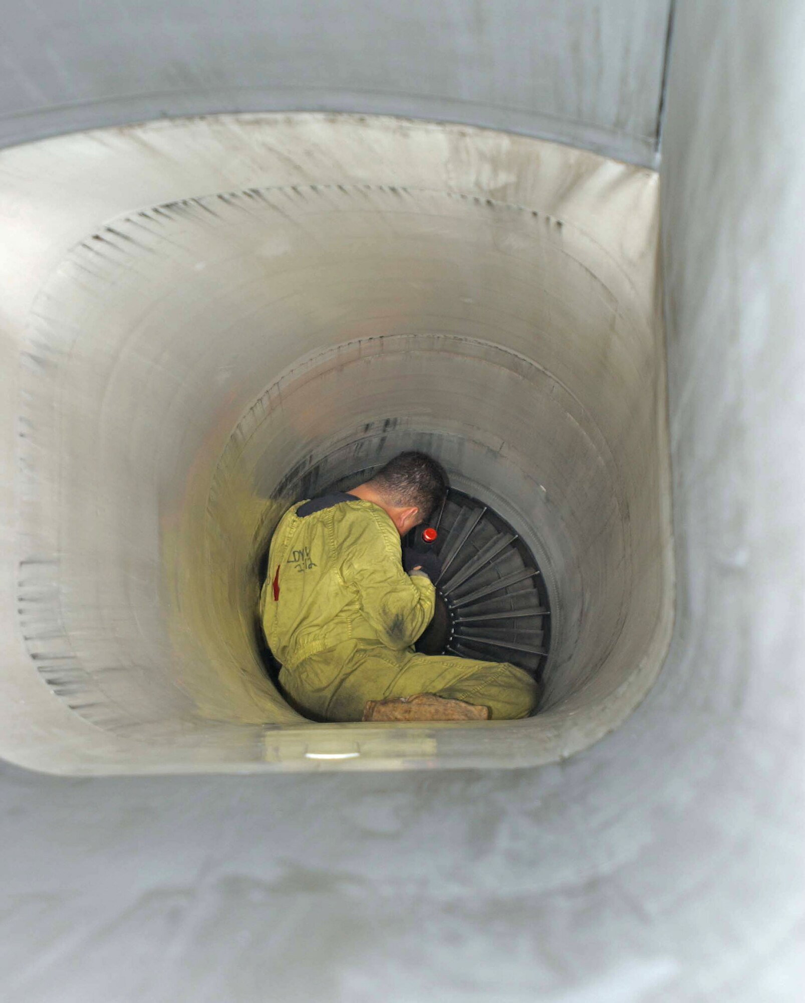 Staff Sgt. Roger Braun inspects an engine intake for damage as part of a through flight inspection Aug. 13 at Keflavik Airport, Iceland. Three F-15 Eagles and two KC-135 Stratotankers are participating from Royal Air Force Lakenheath and RAF Mildenhall, both from England. Sergeant Braun is assigned to the 493rd Fighter Squadron from RAF Lakenheath. (U.S. Air Force photo/Tech. Sgt. J. LaVoie) 
