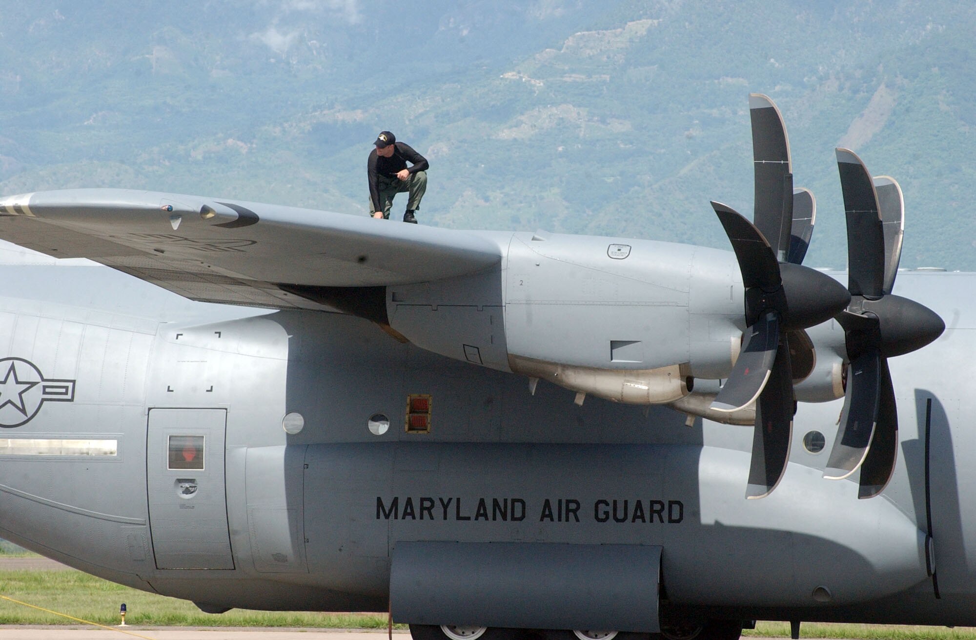 SOTO CANO AIR BASE, Honduras – Tech. Sgt. Edward Slavin, a crew chief with the 135th Airlift Squadron, Maryland Air National Guard, inspects the exterior of a C-130J prior to a relief mission to Peru Aug. 17. The aircrew is taking approximately 30 Soldiers and Airmen who are responding to the Aug. 15 earthquake in Peru and are taking with them 4,470 pounds of medical supplies for relief efforts.  (US Air Force photo by Tech. Sgt. Sonny Cohrs)