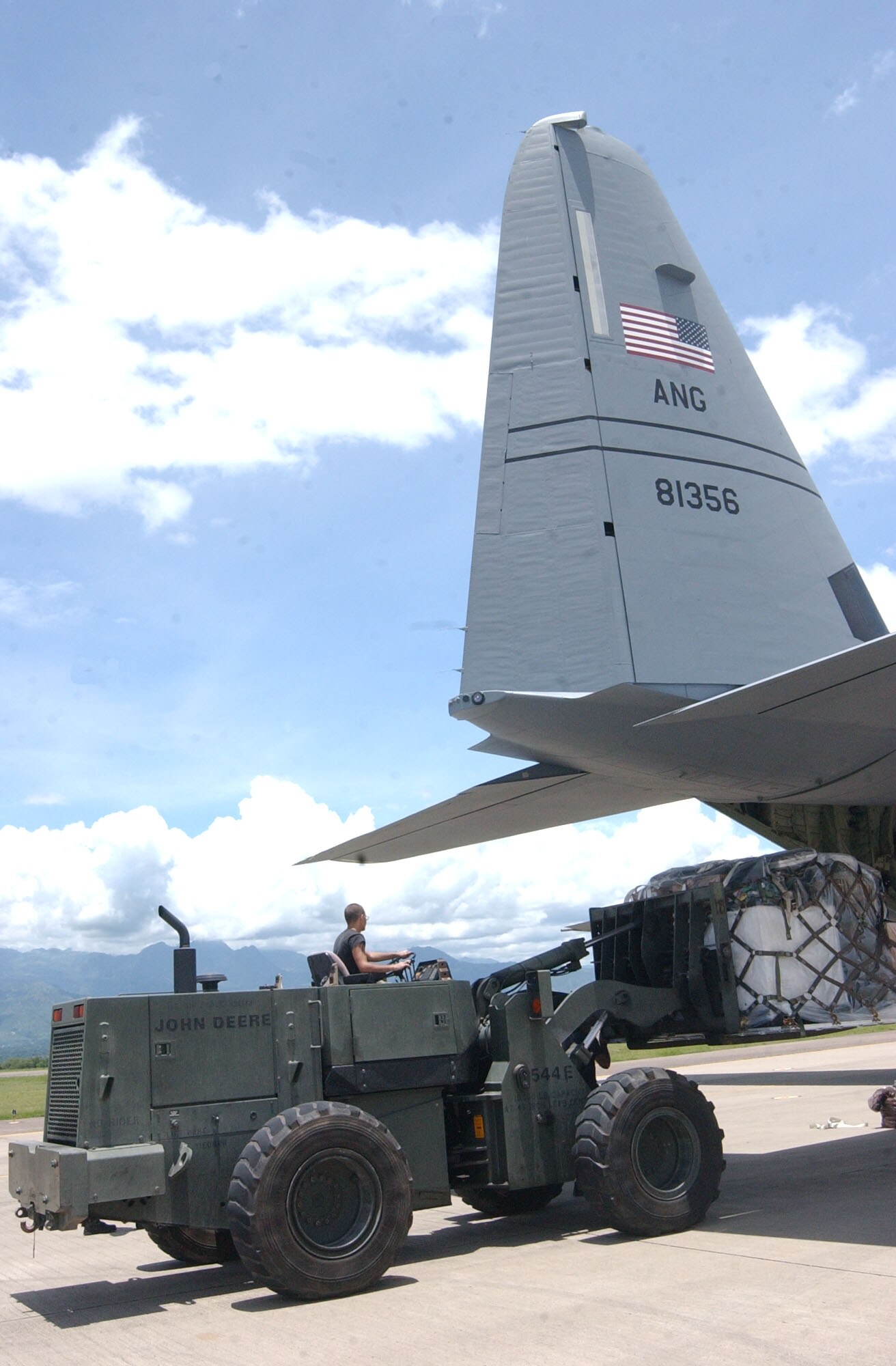 SOTO CANO AIR BASE, Honduras – Senior Airman Kenneth Cumbie, 612th Air Base Squadron here, drives a forklift to load medical supplies onto a C-130J from the Maryland Air National Guard. Approximately 30 Soldiers and Airmen are responding to the Aug. 15 earthquake in Peru and are taking with them 4,470 pounds of medical supplies for relief efforts.  (US Air Force photo by Tech. Sgt. Sonny Cohrs)