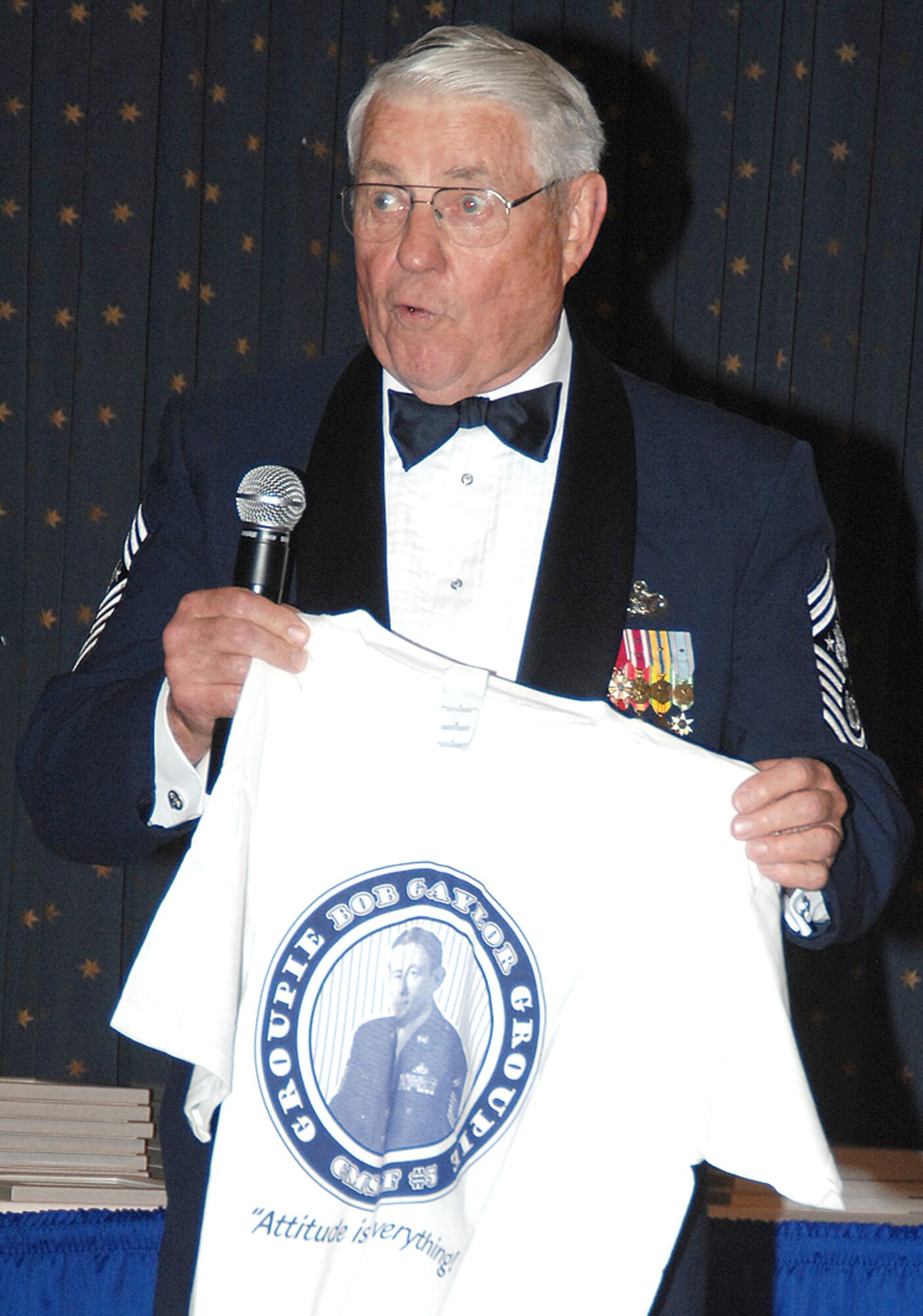 Chief Gaylor shows off his official ?Bob Gaylor Groupie? T-shirt for a little comic relief during his talk. U.S. Air Force photo by Todd Berenger