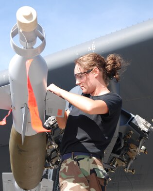 SrA Jessica Landry, 917th Aircraft Maintenance Squadron weapons loader, installs safety devices on a GBU-12 laser guided bomb loaded on a B-52H Stratofortress after its return from a bombing mission in support of Valiant Shield, Andersen AFB, Guam, on 07 Aug 2007. (U.S. Air Force photo/Master Sgt. Greg Steele)