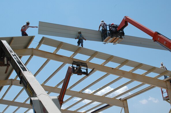 Contractors construct the A-10 sunshades on the flight line. (U.S. Air Force photo/Staff Sgt. Ebony Nichols)
