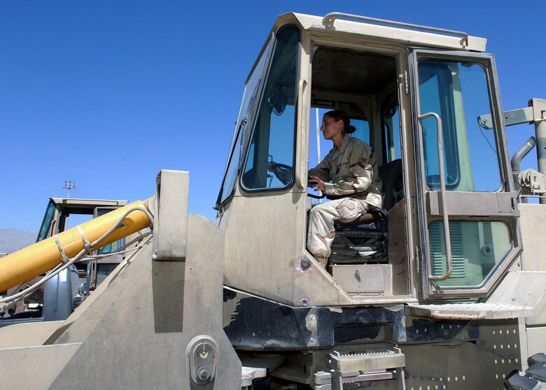 Senior Airman Sarah Hansen, 67th Expeditionary Aerial Port Squadron, uses a forklift to pick up cargo pallets to load into the cargo area of a C-130. Airman Hansen is a reservist deployed from Hill Air Force Base, Utah. (U.S. Air Force photo by Staff Sgt. Craig Seals)