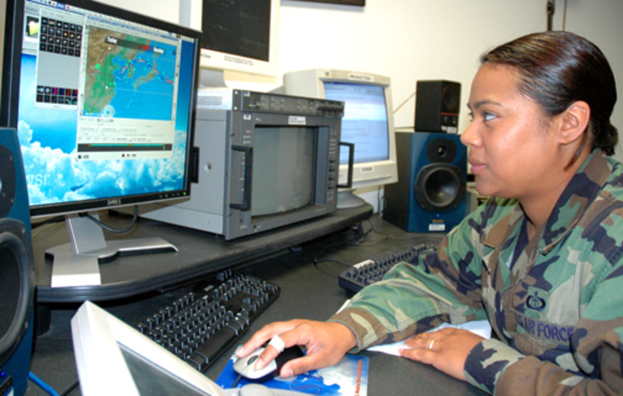 Staff Sgt. Annette Prato, a broadcast weather technician at Offutt Air Force Base, Neb., uses their new WSI system to create visuals for their Pacific weather forecast. According to the Rancho Cordova, Calif., native the final product will include detailed graphics, precipitation and an audio voice over. 