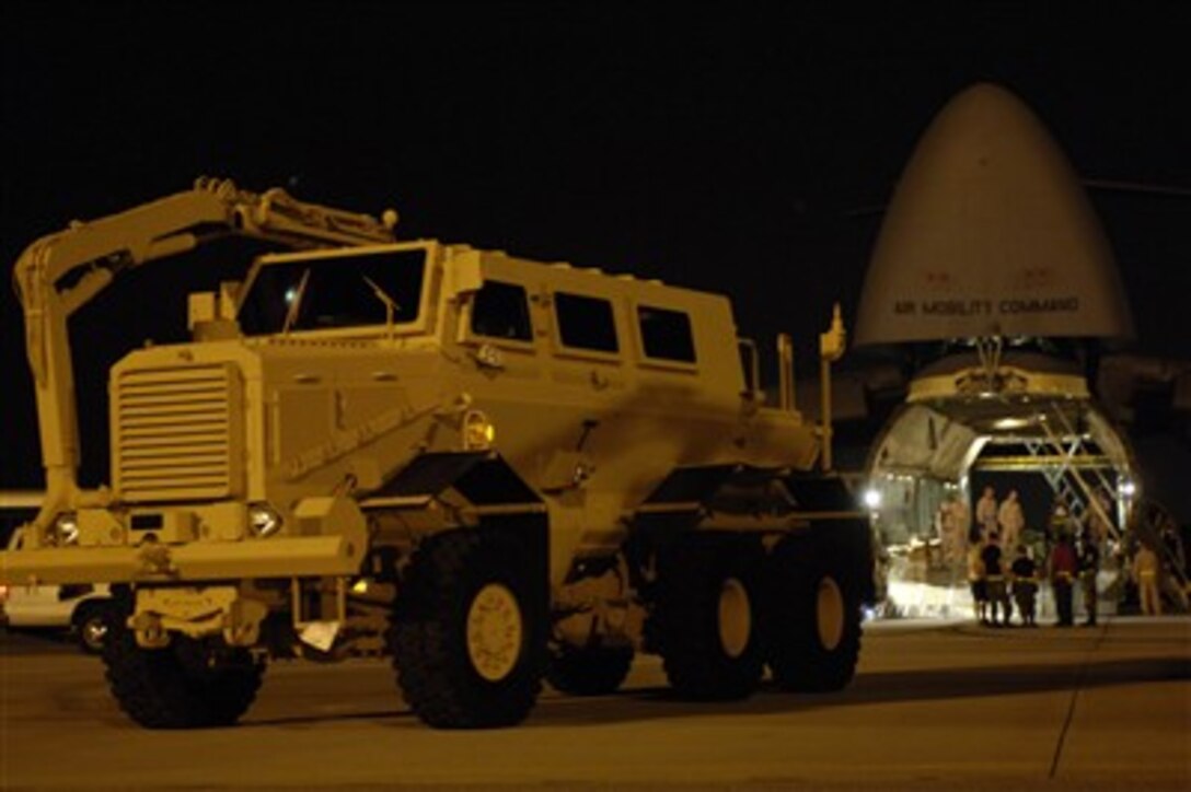 U.S. Air Force airmen prepare to load a Mine Resistant Ambush Protected (MRAP) vehicle into a C-5 Galaxy aircraft for shipment to Iraq at Charleston Air Force Base, S.C. on Aug. 16, 2007.  