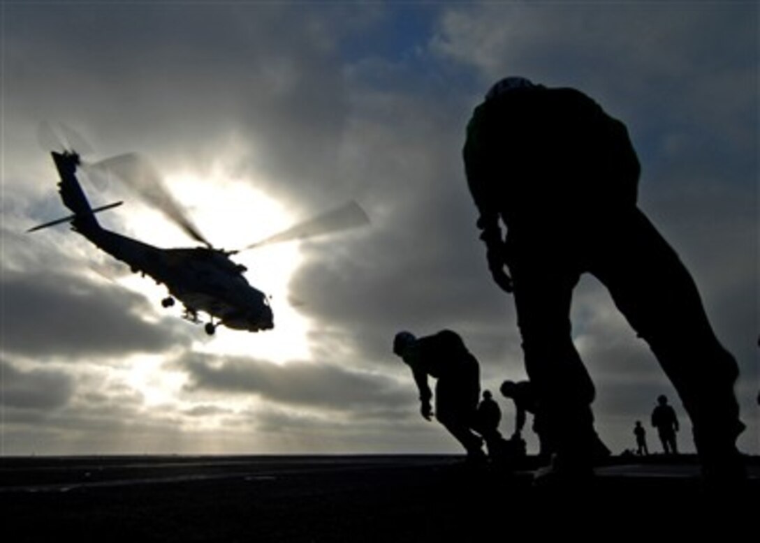 A U.S. Navy SH-60F Seahawk helicopter from takes off from the flight deck of the aircraft carrier USS Abraham Lincoln (CVN 72) as the ship operates in the Pacific Ocean on Aug. 15, 2007.  