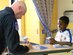 Master Sgt. Tim Green, F-22 Raptor demonstration team superintendent, signs lithographs for patients at La Rabida Children's Hospital in Chicago Aug. 15. (U.S. Air Force photo/Capt. Rob Lazaro)
