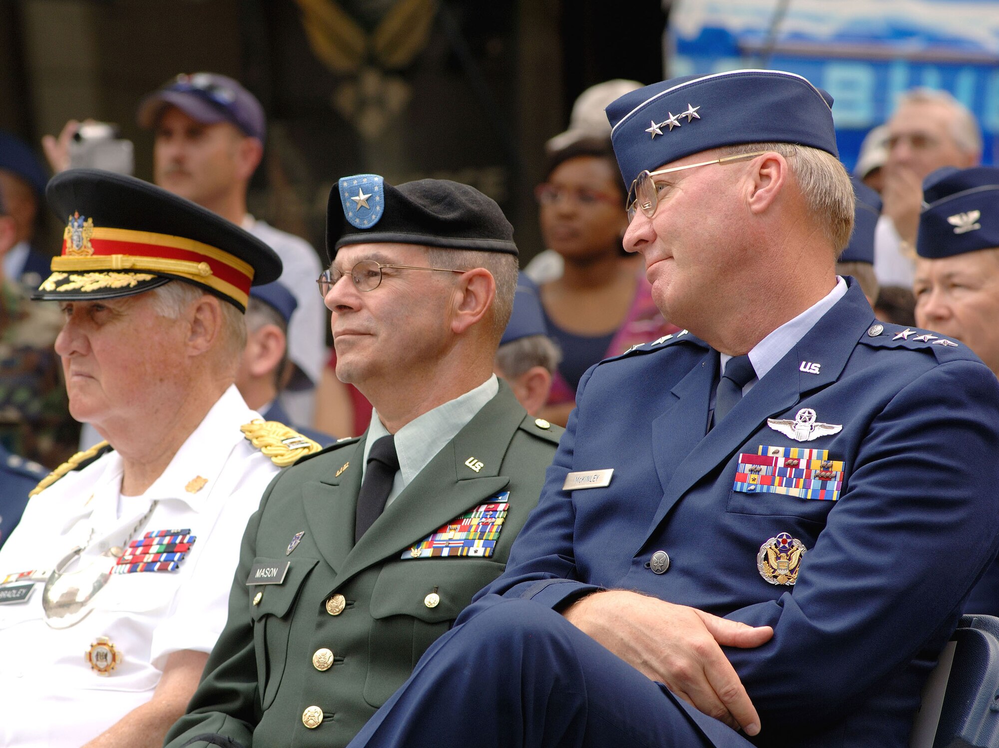 (From left) Capt. John E. Bradley, Brig. Gen. Oliver J. Mason Jr. and Lt. Gen. Craig R. McKinley watch members of the U.S. Air Force Honor Guard Drill Team perform their 16-man routine during a proclamation ceremony for Air Force Week New England in front of historic Faneuil Hall in downtown Boston Aug. 17. Captain Bradley is the captain commanding of the 299th Artillery Company of Massachusetts and Proclamation Reception Host. General McKinley is director of the Air National Guard. (U.S. Air Force photo/Staff Sgt. Bennie J. Davis III)