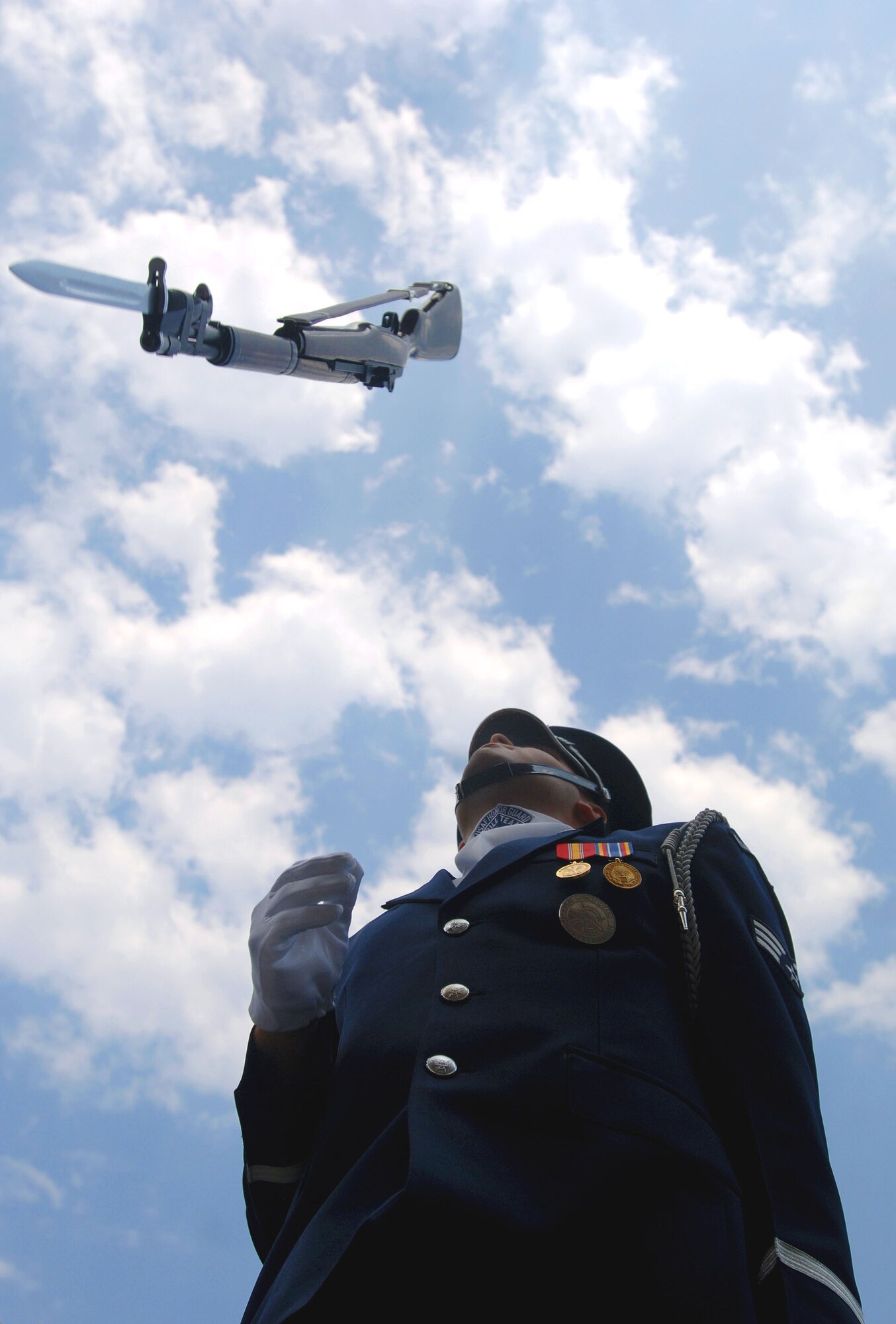 Senior Airman James Cashwell of the United States Air Force Honor Guard Drill Team performs during a proclamation ceremony for Air Force Week New England in front of historic Faneuil Hall in downtown Boston Aug. 17. The drill team is the traveling component of the Air Force Honor Guard and tours worldwide showcasing the precision of today's Air Force to recruit, retain and inspire Airmen. (U.S. Air Force photo/Staff Sgt. Bennie J. Davis III) 