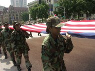 Tech Sgt. Adriane Craig calls out the cadence as the 932nd Airlift Wing marches on July 4, 2007.  Photo by Tech Sgt. Dan Oliver.