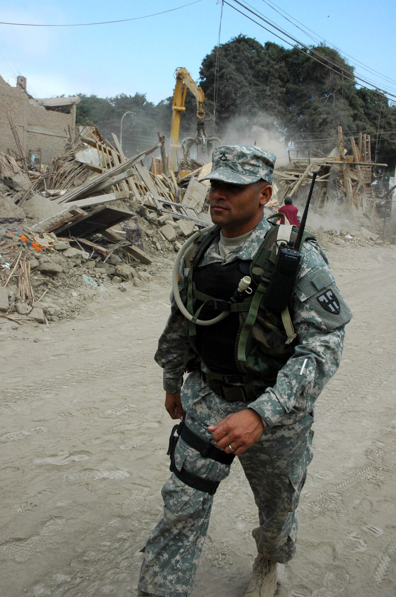 Army Private 1st Class David Torres observes the damage in Pisco, Peru, Aug. 19 following the 8.0 magnitude earthquake which struck the region Aug. 15. A task force from Joint Task Force-Bravo at Soto Cano Air Base, Honduras, traveled to Peru to provide medical humanitarian relief following the disaster. Private Torres is a security forces member with JTF-B. (U.S. Army photo/Spc. Grant Vaught)