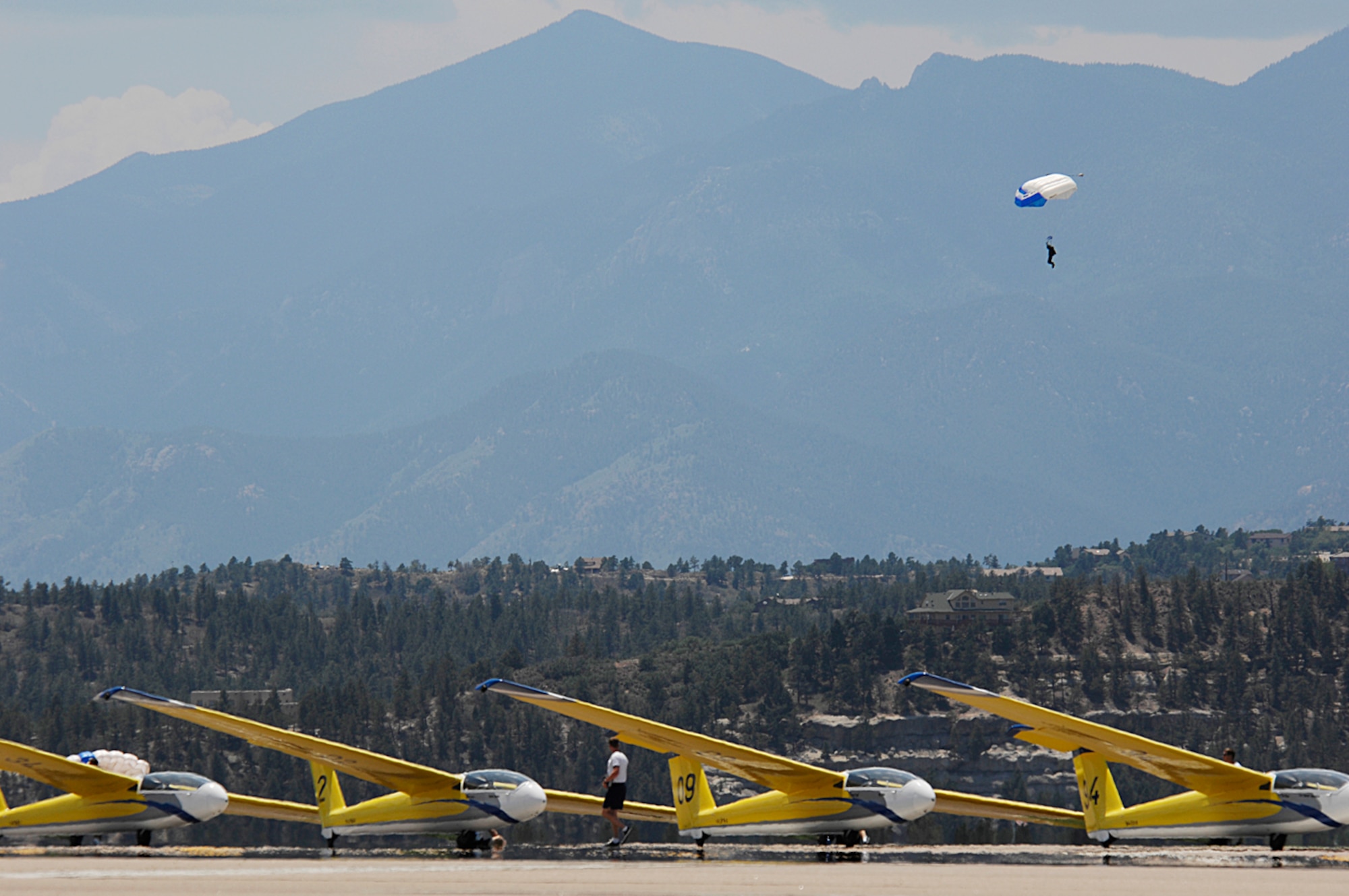 With cadets parachuting out of airplanes and flying gliders, the skies above the U.S. Air Force Academy are nearly always buzzing with activity. Despite a crowded airfield and challenging weather, the 306th Flying Training Group sports an excellent safety record. (photo by Tech. Sgt. Matthew Hannen)