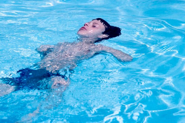 When an Airman pulled a young boy from the water and discovered he wasn’t breathing, he had to use CPR to save him. (Photo by Tim Barela)