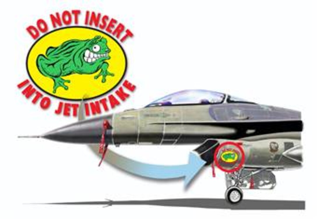 An illustration of an F-16 and a fictitious decal portraying a saluting frog. The instruction being that frogs are not to be inserted into F-16 jet intakes. (Illustration by Sammie W. King)