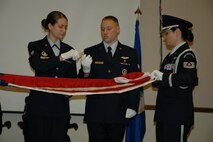 The 932nd Airlift Wing honor guard members take care of the American flag during a military ceremony at Scott Air Force Base.  Members who want to be part of the honor guard should visit the office in building 3650.  Photo/Tech Sgt. Gerald Sonnenberg
