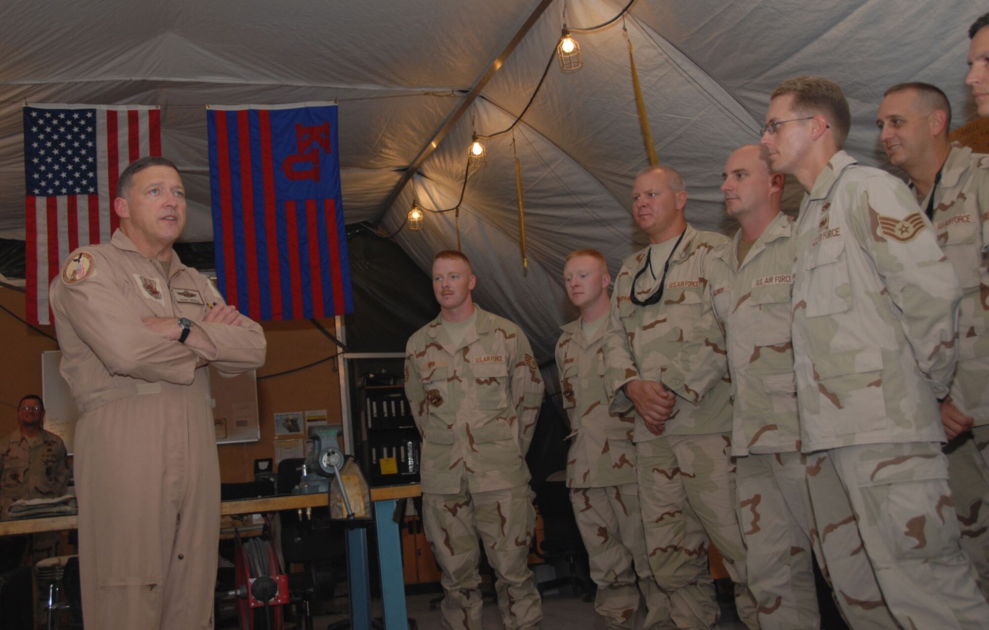 Lt. Gen. Gary North visits with Airmen of the 71st Expeditionary Air Control Squadron in Southwest Asia. The general is the commander of U.S. Central Command Air Forces and 9th Air Force. During his visit, General North discussed the importance of the squadron's mission to the war on terrorism. (U.S. Air Force photo/Airman 1st Class Ashley Tyler)