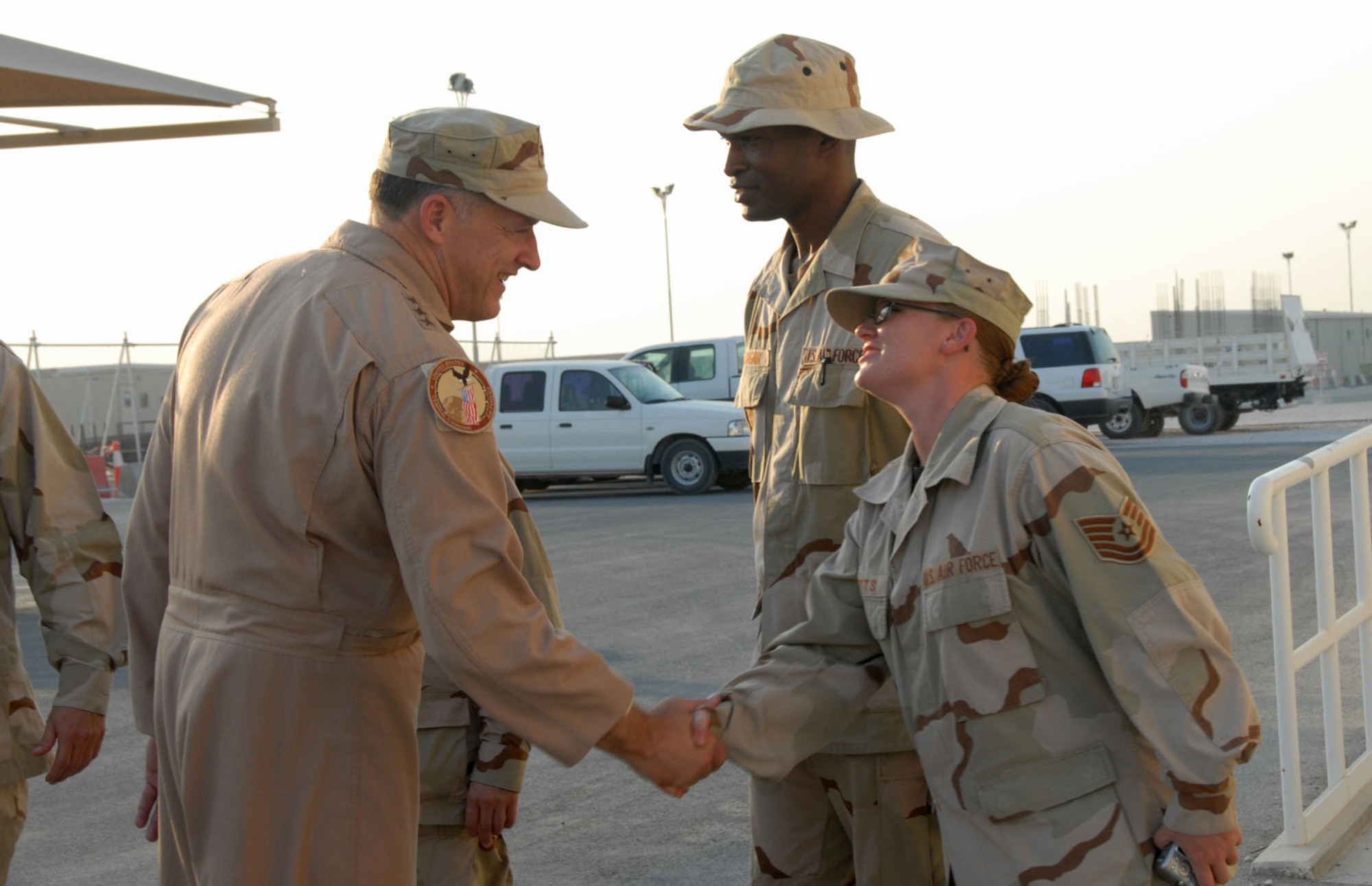 Lt. Gen. Gary North greets Tech. Sgt. Jennifer Butts during his tour Aug. 15 of the base's medical facilities at the 379th Air Expeditionary Wing in Southwest Asia. The general is the commander of U.S. Central Command Air Forces and 9th Air Force. During his visit, General North met with servicemembers recovering from wounds they received while serving in Operations Iraqi Freedom and Enduring Freedom. Sergeant Butts is assigned to the 379th Expeditionary Medical Group. (U.S. Air Force photo/Airman 1st Class Ashley Tyler)