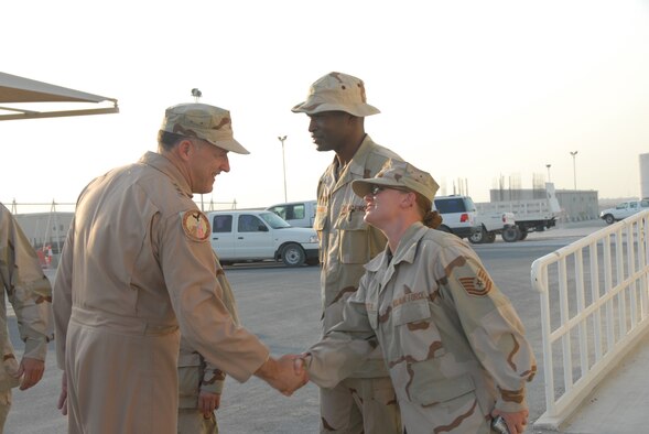 Lt. Gen. Gary North, U.S. Central Command Air Forces commander and 9th Air Force commander, greets Tech. Sgt. Jennifer Butts, 379th Expeditionary Medical Group, during his tour of the base’s medical facilities. During his visit, the general met with several servicemembers who are here recovering from wounds they received while serving in Operations Iraqi and Enduring Freedom. (U.S. Air Force photo by Airman 1st Class Ashley Tyler)