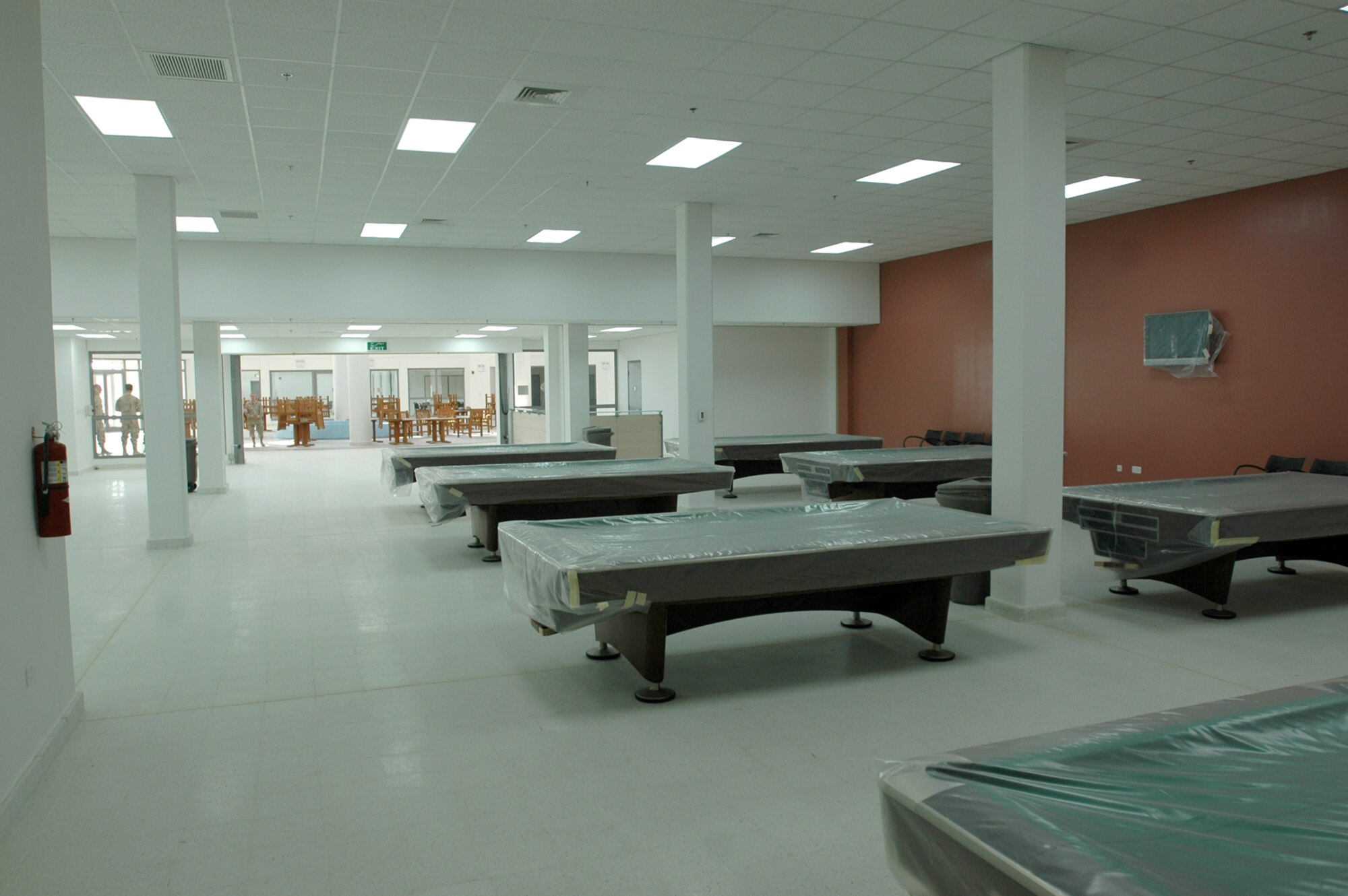The Community Activity Center will be located in a large space and will feature pool tables, a phone bank, movie rooms, a video game room and more.   (U.S. Air Force photo by Senior Airman Clark Staehle)    