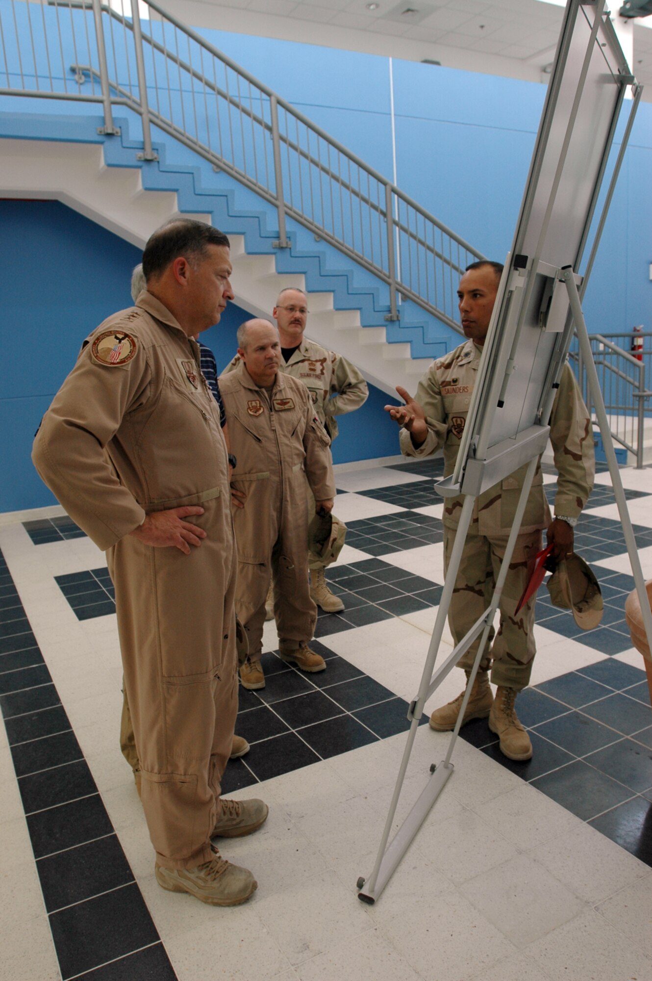 Lt. Col. Michael Saunders, 379th Expeditionary Civil Engineer Squadron commander (right) briefs Lt. Gen. Gary North, U.S. Central Command Air Forces and 9th Air Force commander on the features and capabilities Millennium Village will bring to the Desert Eagle Team once it is complete. (U.S. Air Force photo by Senior Airman Clark Staehle)    
