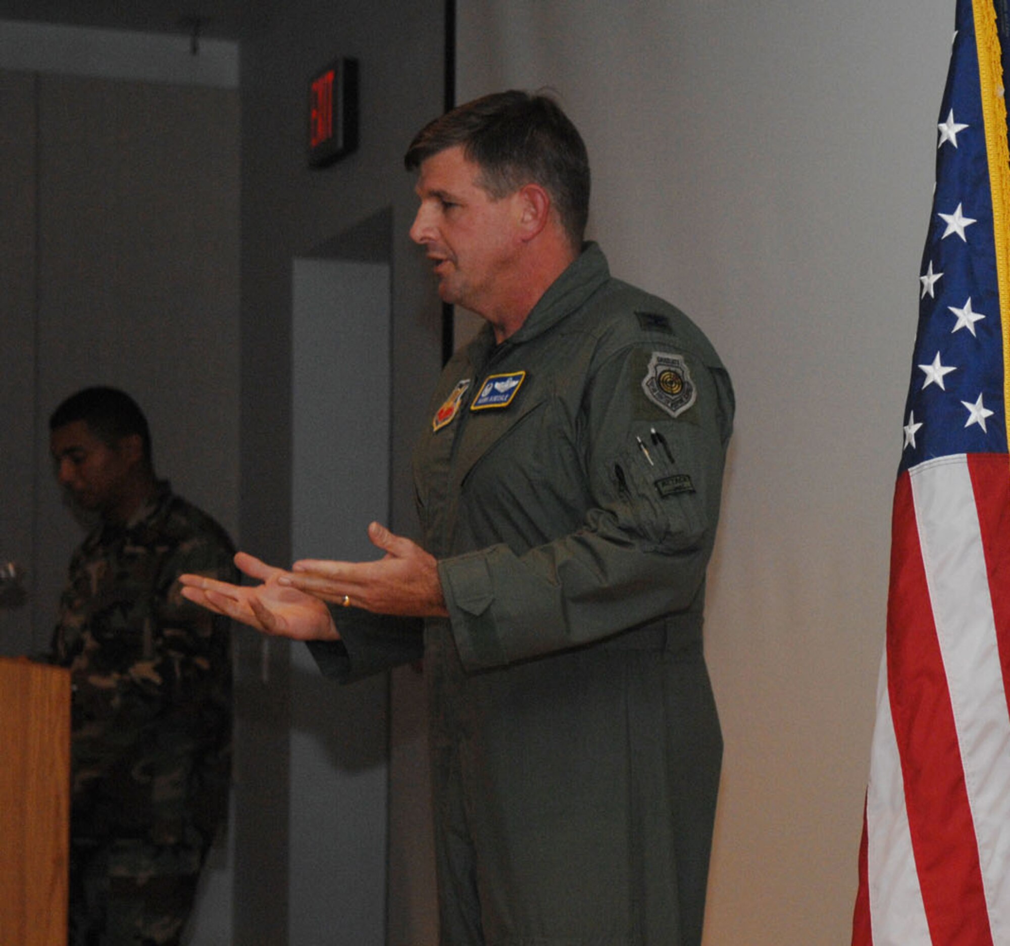 Colonel Mark Koechle gives a briefing at the 98th Range Wing commander's call August 9. Colonel Koechle took command of the Range Wing July 20. (US Air Force photo by Airman First Class Brian Ybarbo) 