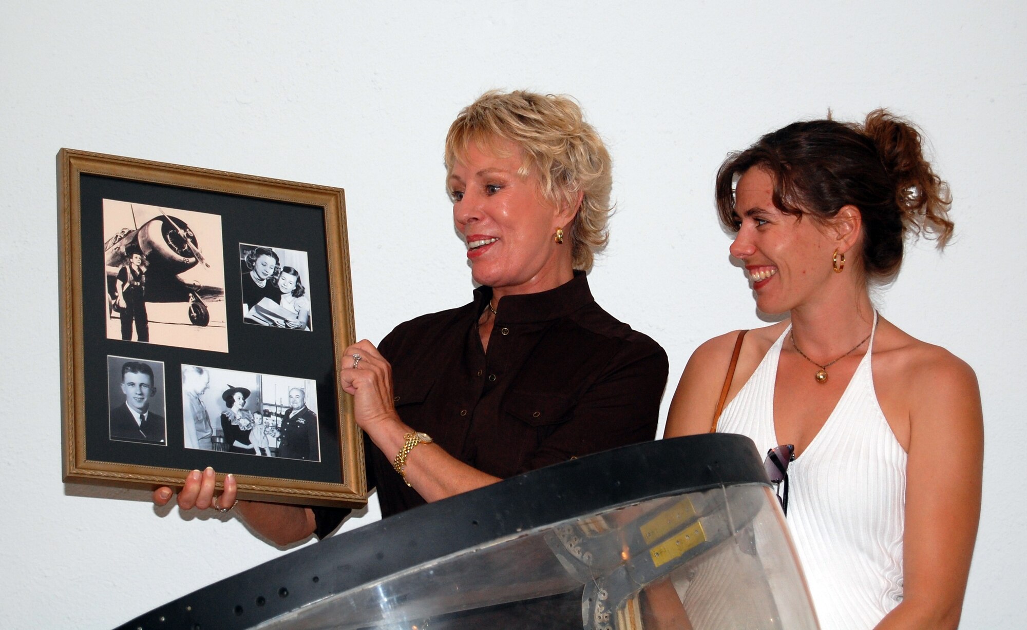 LAUGHLIN AIR FORCE BASE, Texas -- Mrs. Jacki Laughlin Mitchell and her daughter, Holly, present a memento to the Laughlin Heritage Foundation during their recent visit to Laughlin Air Force Base and Del Rio.  (U.S. Air Force photo by Capt. Ken Hall)