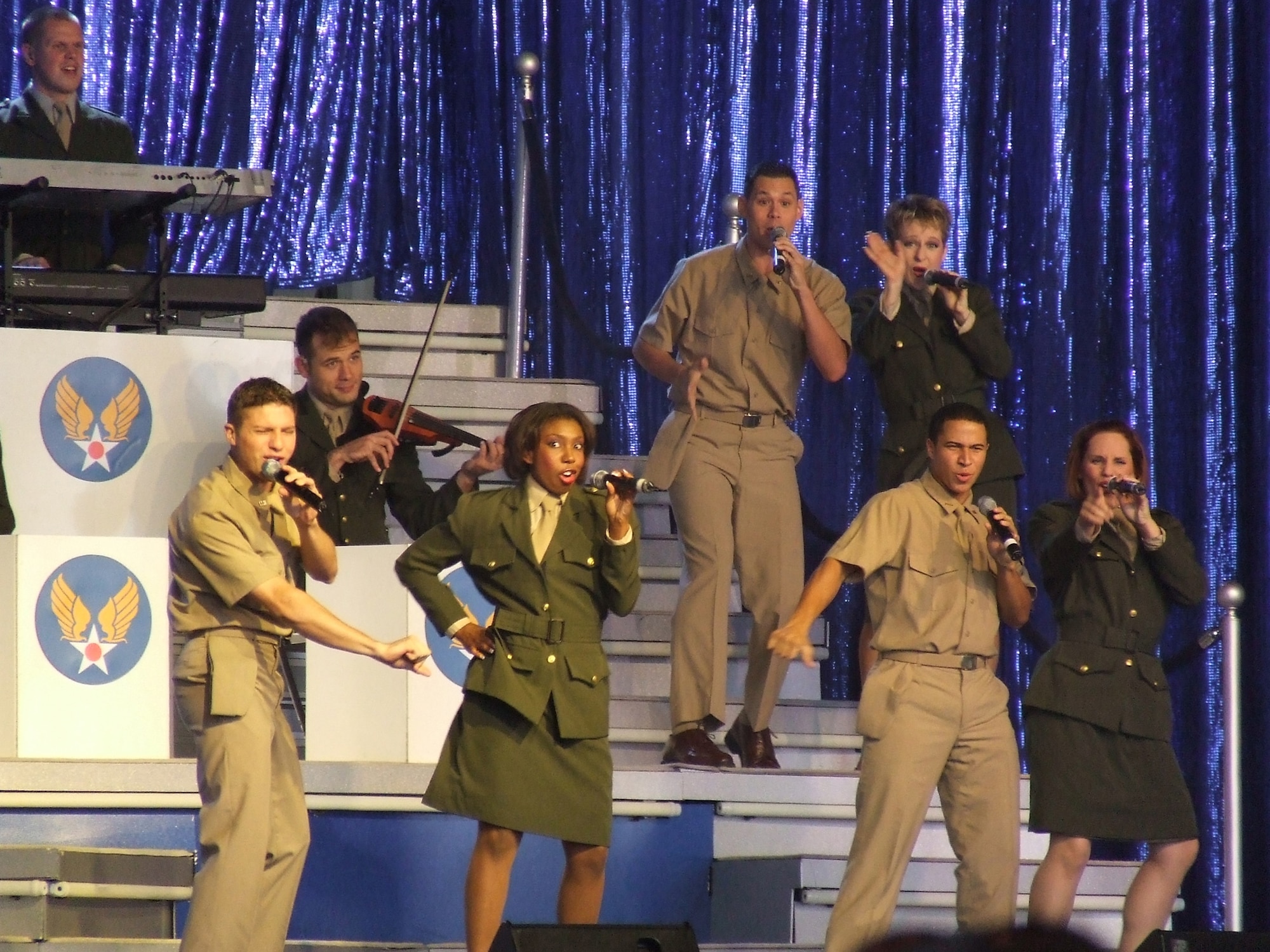 Performers with the U.S. Air Force entertainment showcase, Tops in Blue, play a number during a show at McGuire Air Force Base, N.J., Aug. 14.  The 2007 edition of Tops in Blue is themed on the 60th anniversary of the Air Force.  (U.S. Air Force Photo/Tech. Sgt. Scott T. Sturkol)
