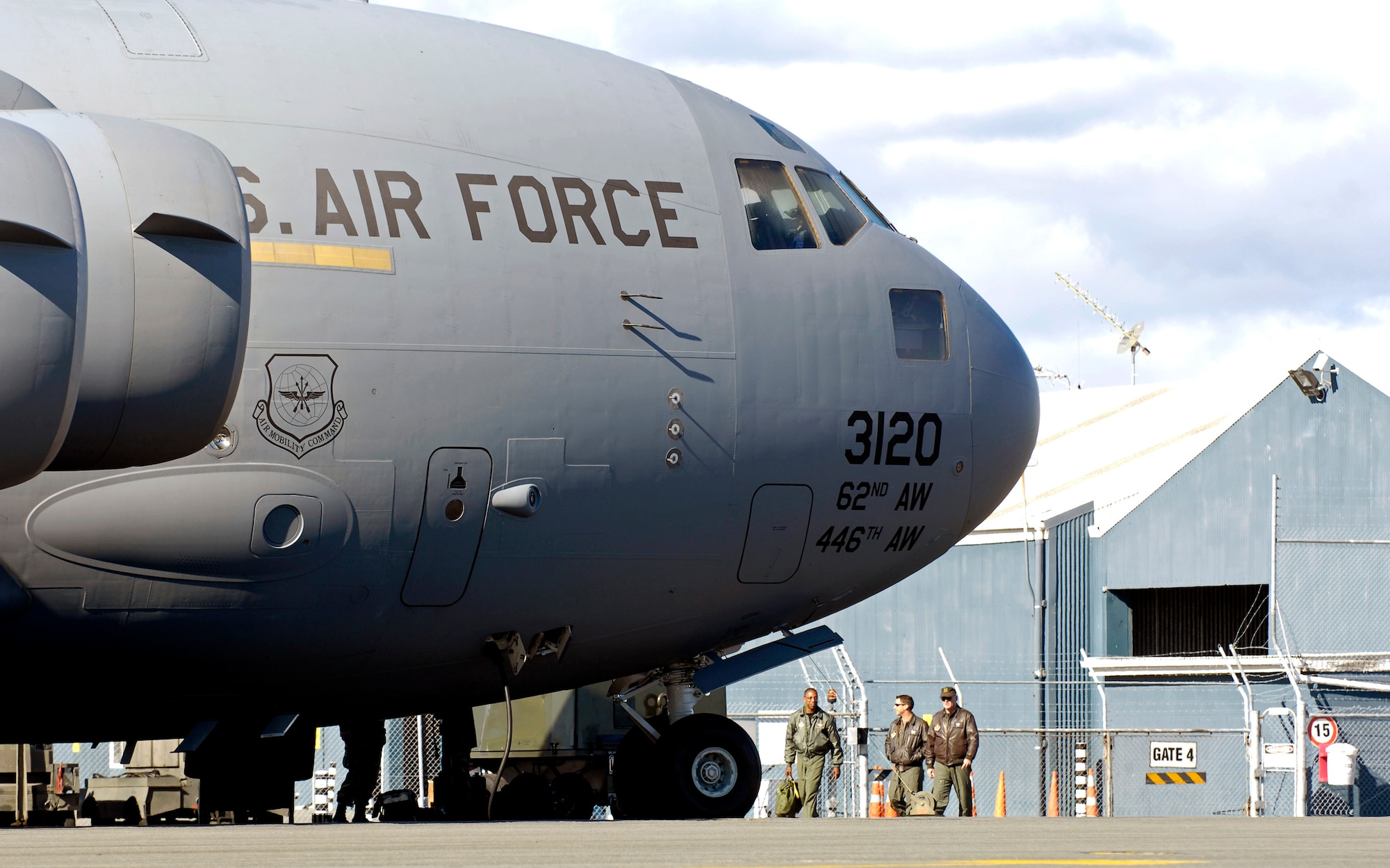 Loadmasters walk to their C-17 Globemaster III to begin preparations for the upcoming winter fly-in missions to Antarctica at Christchurch, New Zealand, Aug. 19. This C-17 and 31 Airmen from McChord Air Force Base, Wash., will begin the annual winter fly-in augmentation of scientists, support personnel, food and equipment for the U.S. Antarctic Program at McMurdo Station Aug. 20. WinFly is the opening of the first flights to McMurdo station, which closed for the austral winter in February. (U.S. Air Force photo/Tech. Sgt. Shane A. Cuomo) 