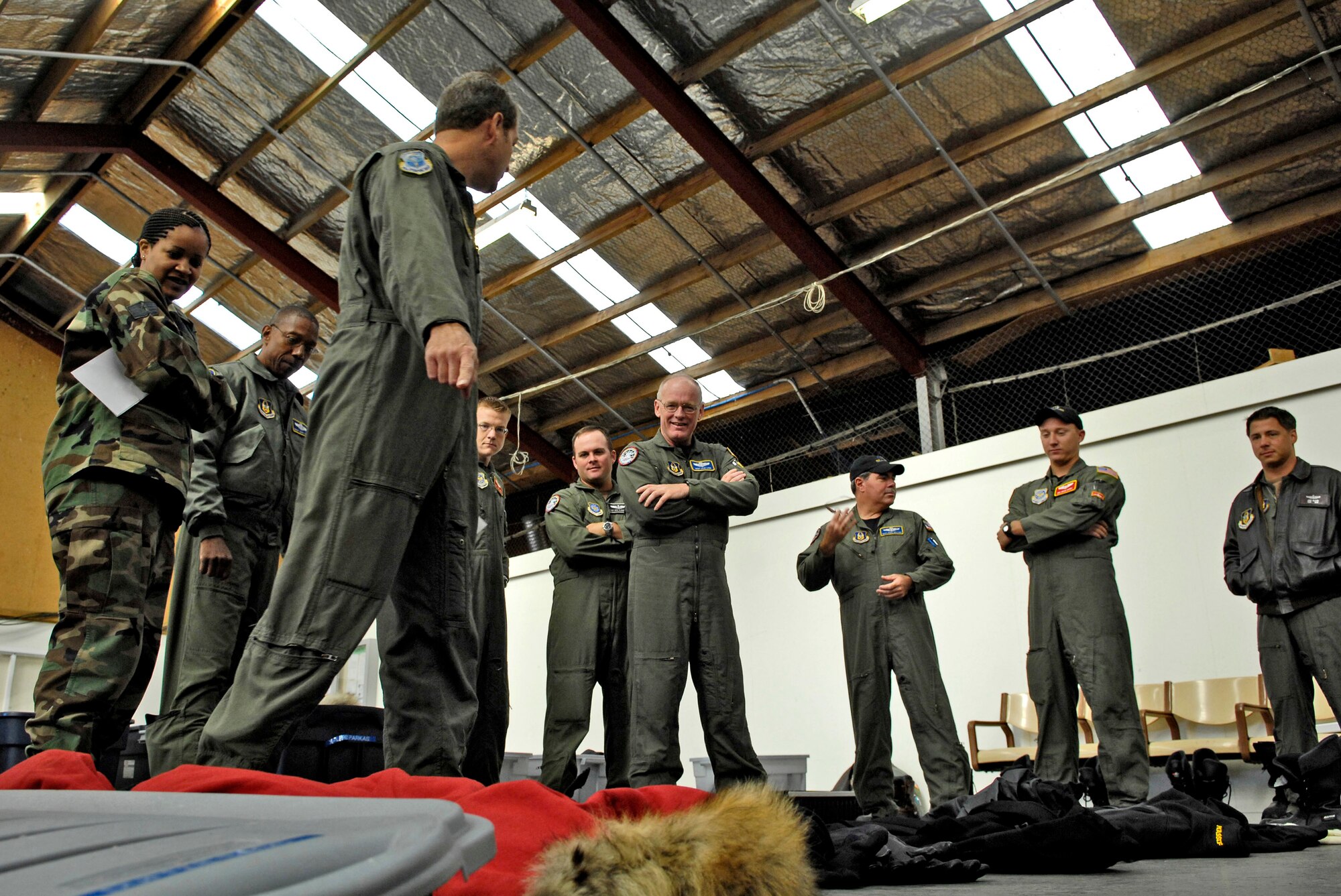 Senior Master Sgt. Jim Masura briefs his C-17 Globemaster III loadmasters on cold weather gear for the upcoming winter fly-in missions to Antarctica at Christchurch, New Zealand, Aug. 19. A C-17 and 31 Airmen from McChord Air Force Base, Wash., will begin the annual winter fly-in augmentation of scientists, support personnel, food and equipment for the U.S. Antarctic Program at McMurdo Station Aug. 20. WinFly is the opening of the first flights to McMurdo station, which closed for the austral winter in February. (U.S. Air Force photo/Tech. Sgt. Shane A. Cuomo) 