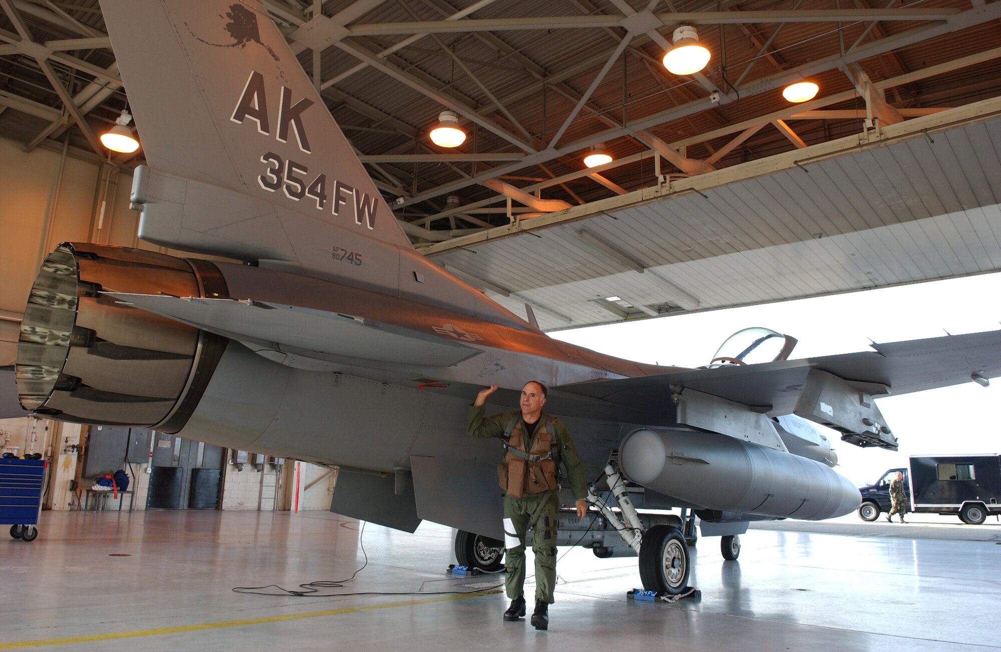 EIELSON AIR FORCE BASE, Alaska -- Brig. Gen. David Scott, 354th Fighter Wing Commander, inspects his F-16 Fighting Falcon aircraft prior to his fini flight on Aug. 17 2007. General Scott arrived at Eielson AFB back in Dec. 05 and will be departing in Aug. 07 to a NATO base in Greece as the Deputy Commander of Combined Air Operations Center. (U.S. Air Force Photo by Airman 1st Class Jonathan Snyder)