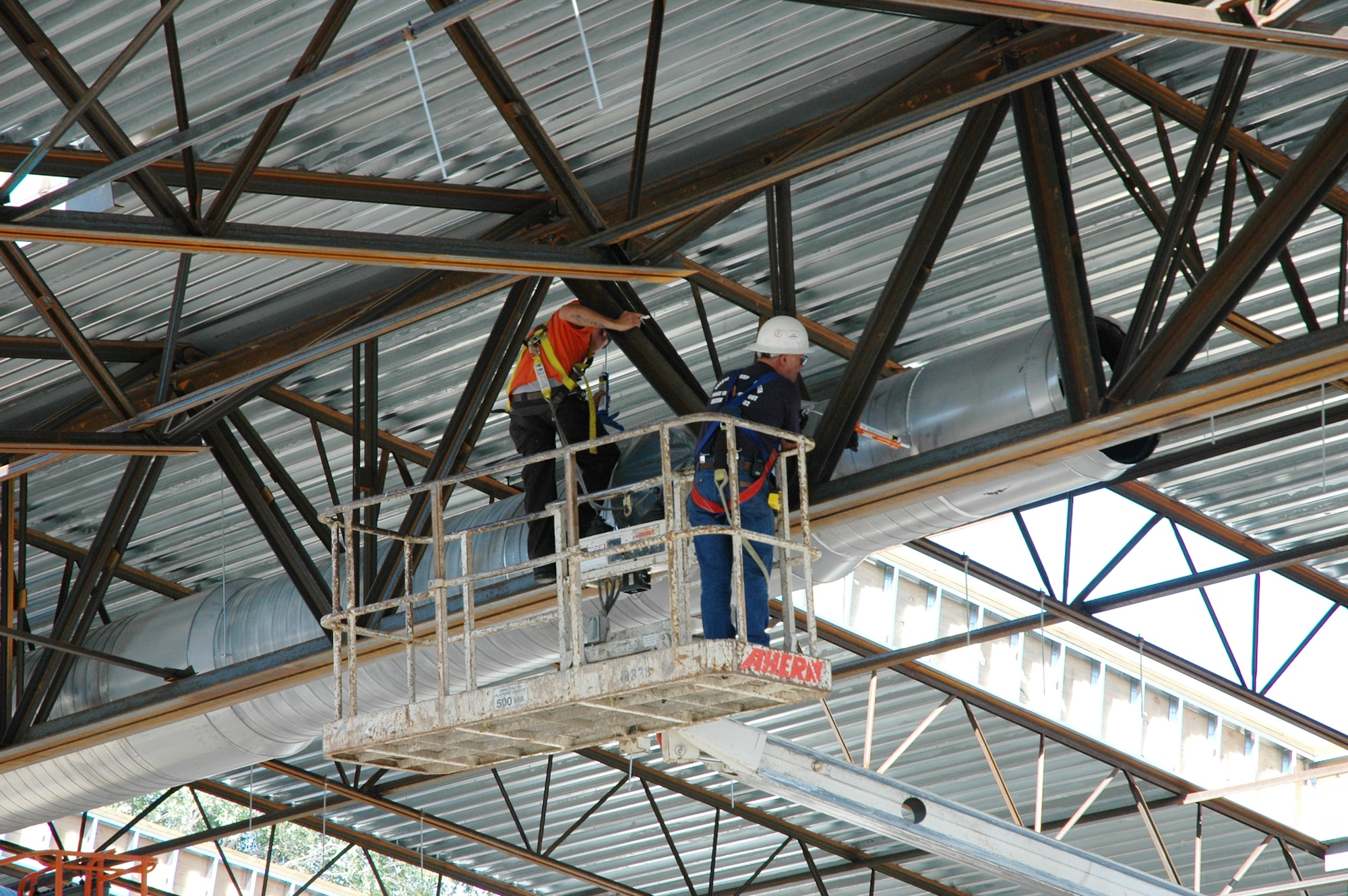 A construction crew works on the heating and cooling system at the base pool. The pool is tentatively scheduled to reopen in early 2008. (U.S. Air Force photo by Tech. Sgt. Kimberley Young)